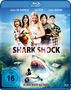 "SHARK SHOCK" in großen Buchstaben, darunter: "NO MORE MISTER NICE SHARK." Mehrere Personen mit Waffen, ein Hai im Wasser.
