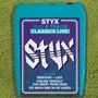 Text: "STYX BMG 8-Track Classics Live! Featuring Renegade, Lady, Fooling Yourself (The Angry Young Man), Too Much Time on My Hands." Retro Kassette mit schlichtem Design., CD