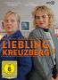 "KANZLEI LIEBLING KREUZBERG" in orange; Gabriela Maria Schmeide und Luise von Finckh schauen in entgegengesetzte Richtungen., DVD