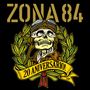 "ZONA 84" oben, darunter "20 ANIVERSARIO!" auf gelbem Banner vor einem Schädel mit Fliegerkappe., LP