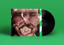 Ein schwarzes Vinyl vor einem Cover mit einem verzerrten Gesicht auf grünem Hintergrund., LP