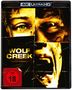 Text: "WOLF CREEK", "FSK ab 18". Zeigt ein verzerrtes Gesicht, teils schreiend, in gelb-bräunlichen Tönen.