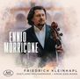 "ENNIO MORRICONE," darunter "FRIEDRICH KLEINHAPL VOGTLAND PHILHARMONIE SIMON EDELMANN." Ein Mann mit Cello. Aquarellstil., CD