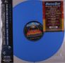 Schriftzug: "Status Quo Driving to Glory". Eine blaue Vinylplatte mit einem Auto und Flammen auf dem Etikett., LP