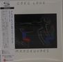 **GREG LAKE** und **MANOEUVRES** in Großbuchstaben, mit tanzenden Figuren in Rot, Blau und Grün gegen dunklen Hintergrund., CD