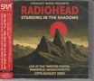 "Straight Music Presents Radiohead Standing in the Shadows", Bergsilhouette vor rotem Mond. Links vertikaler Text-Block., 2 CDs