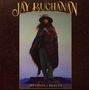 "Jay Buchanan" oben, "Weapons of Beauty" unten. Eine Person mit Hut und Poncho steht in einer mystischen Landschaft., CD