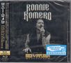 „Ronnie Romero“, „Live at Rock Imperium Festival“. Ein Sänger hält ein Mikrofon, im Hintergrund ein Publikum.
