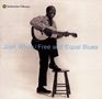 Der Text lautet: "Josh White / Free and Equal Blues". Eine Person sitzt lachend, spielt Gitarre und hat einen Fuß auf einem Hocker.