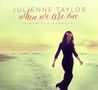 "Julienne Taylor, when we are one, feat. Daniele Ferretti." Frau in schwarzem Kleid mit Blumenkranz am Strand.
