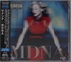 Texte: MDNA, Madonna Collection, Parental Advisory. Illustration: Frau in rotem Kleid mit verwischten Lichteffekten.