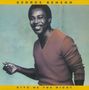"George Benson, Give Me the Night." Ein lächelnder Mann in einem orangefarbenen Pullover vor blassem Hintergrund., CD