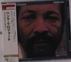 Ein CD-Cover zeigt ein ernstes Gesicht. Texte: "Hank Crawford", "Wildflower", und japanische Schriftzeichen., CD