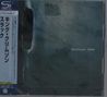 Text: "King Crimson THRAK" und japanische Schriftzeichen. Blau-grüner Hintergrund mit Textur, CD-Hülle mit Schutzhülle., CD