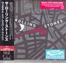 Texte in Englisch und Japanisch. "Rolling Stones Welcome to Shepherd’s Bush." Stilisiert auf einem abstrakten Muster.
