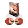 „Quiet Sun Mainstream“ steht auf einem Buch und zwei CDs. Illustration zeigt einen Turm, Stadtansicht und einen großen runden Mond., 1 CD und 1 Blu-ray Audio