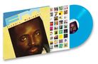"Freddie McGregor" und "FM" auf einem Plattencover. Davor eine blaue Vinyl-Schallplatte. Im Hintergrund kleine Coverabbildungen., LP