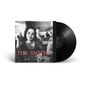 Text: "THE SMITHS BEST..." Schwarze Vinyl-Schallplatte neben einem schwarz-weißen Coverfoto einer Frau in einem Café., LP