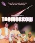 Text: "Take off on a cosmic music trip with the new 'Toomorrow'. Olivia Newton-John in TOOMORROW." Menschen in bunten Outfits.