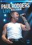 "PAUL RODGERS LIVE IN GLASGOW." Ein Mann singt leidenschaftlich, trägt ein weißes Tanktop, hält ein Mikrofon.