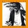 "NATALIA M. KING, WOMAN MIND OF MY OWN." Eine lachende Person mit Dreadlocks tanzt in einem Anzug. Orangefarbener Rahmen., LP