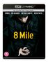 Titel: "8 Mile", oben stehen Namen wie Eminem. Darunter eine Person in dunkler Kleidung mit gesenktem Blick.