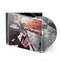 CD-Cover mit dem Text "KRIS BARRAS BAND - MONSTERS WE MADE". Illustration eines roten Monsters mit zerbrochenem Glas., CD