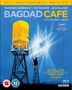 "Bagdad Café - A Film by Percy Adlon. Person auf Leiter malt gelben Wasserturm. Text: 'Intimate, quirky, and affirmative...'“