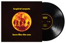 Text: "inspiral carpets", "burn like the sun".  
Illustration eines orange glühenden Sonnensymbols mit Silhouetten.