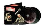 Text: "SPARKS LIVE ON THE MOON", "FRIDAY 8PM". Illustration: Zwei Astronauten im Weltall mit einem Mikrofon, CDs mit Mondmotiv., 2 CDs