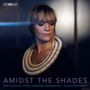 "AMIDST THE SHADES. RUBY HUGHES · MIME YAMAHIRO BRINKMANN · JONAS NORDBERG." Frau mit dekorativem Kragen schaut nach unten.