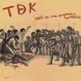 Text: "TDK", "esto es una empresa capitalista".  
Illustration zeigt Menschen, die von Soldaten bedroht werden., LP