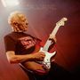 Texte: "Robin Trower Live in the USA One Moment in Time." Visuell: Älterer Mann spielt E-Gitarre mit intensiver Beleuchtung., CD