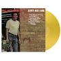 Albumcover "Just As I Am" von Bill Withers, gelbe Vinyl-Platte links, Backsteinmauer im Hintergrund.