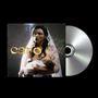 Text „caro“. Eine Frau stillt ein Baby, trägt ein Schleier. CD-Hülle und Disc sind sichtbar., CD
