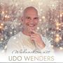 "Weihnachten mit UDO WENDERS." Ein lächelnder Mann vor einem Hintergrund mit Schneeflocken und Lichtern.