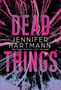 "DEAD THINGS" und "JENNIFER HARTMANN" in großen Buchstaben. Rosa und violette Baumzweige auf schwarzem Hintergrund., Buch