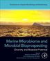 "Marine Microbiome and Microbial Bioprospecting: Diversity and Bioactive Potential." Ein Meer mit Insel im Sonnenlicht., Buch