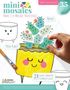 "mini mosaics", "Make 3-D Mosaic Paintings", "Happy Houseplants", "35 PIECES", "Paint", "Then Place!", "21 Super Smooth Pieces of Tumbled Glass".  
Zeichnung eines lächelnden Blumentopfs mit bemalten Steinen., Buch