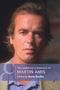 "The Cambridge Companion to Martin Amis, Edited by Gavin Keulks." Ein Mann mit ernstem Blick im Vordergrund., Buch