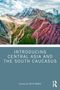 Titel: "INTRODUCING CENTRAL ASIA AND THE SOUTH CAUCASUS". Bearbeitet von Erica Marat. Berglandschaft mit farbigen Hängen., Buch