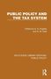 "PUBLIC POLICY AND THE TAX SYSTEM" in Weiß auf Braun. Herausgeber: G. A. Hughes, G. M. Heal. Routledge-Logo unten rechts., Buch