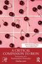 „A Critical Companion to Bion“ von Charles Levin. Kirschen auf rosa gekacheltem Hintergrund, rote untere Hälfte., Buch