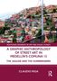 Routledge Buch über Straßenkunst in Medellíns Comuna 13 von Claudio Riga. Bunte Hanghäuser., Buch