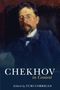 "Chekhov in Context" und "Edited by Yuri Corrigan". Ein Gemälde eines Mannes im Anzug mit Bart und Brille., Buch