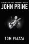 Text: "Living in the Present with John Prine, Tom Piazza." Schwarz-weiß Bild eines Mannes mit Gitarre., Buch