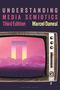 „Understanding Media Semiotics, Third Edition, Marcel Danesi.“ Eine retro TV mit futuristischer Landschaft darin.