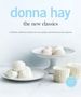 Text: "donna hay the new classics" und "A definitive collection of classics for every modern cook from donna hay magazine".  
Sahne, Eier, weißer Tisch.