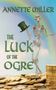 "ANNETTE MILLER, THE LUCK OF THE OGRE." Ein Skelett mit grünem Hut steht vor einem Regenbogen, umgeben von Goldmünzen., Buch