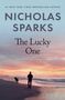 Text: "Nicholas Sparks, The Lucky One, A Novel." Silhouette von Mann und Hund am Strand bei Sonnenuntergang.
